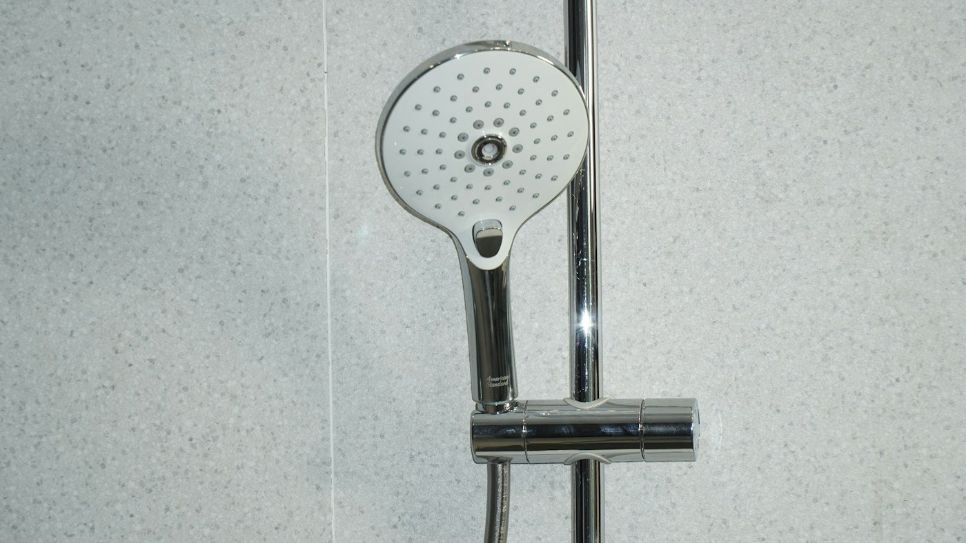 Shower fitting against tiled walls