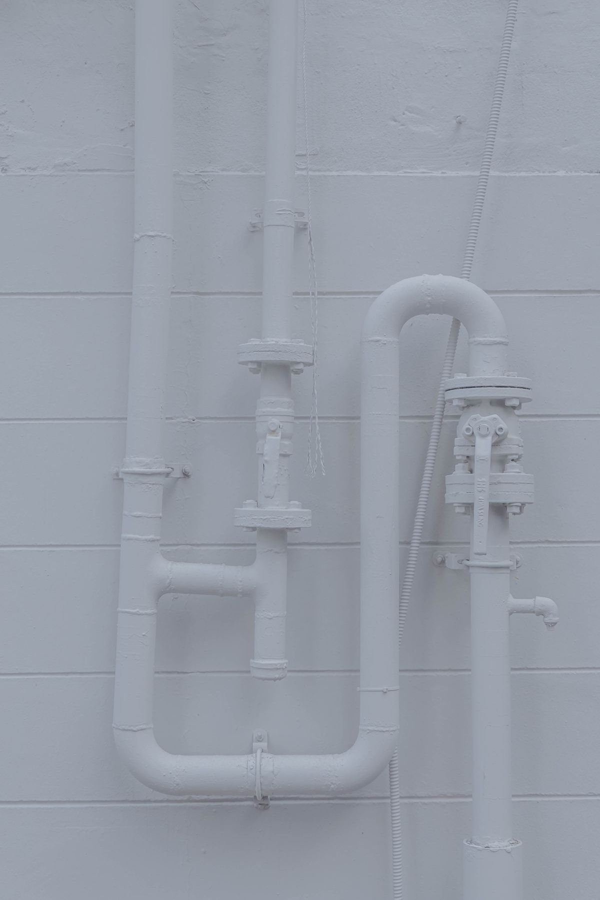 Plumber in Enfield repairing pipework