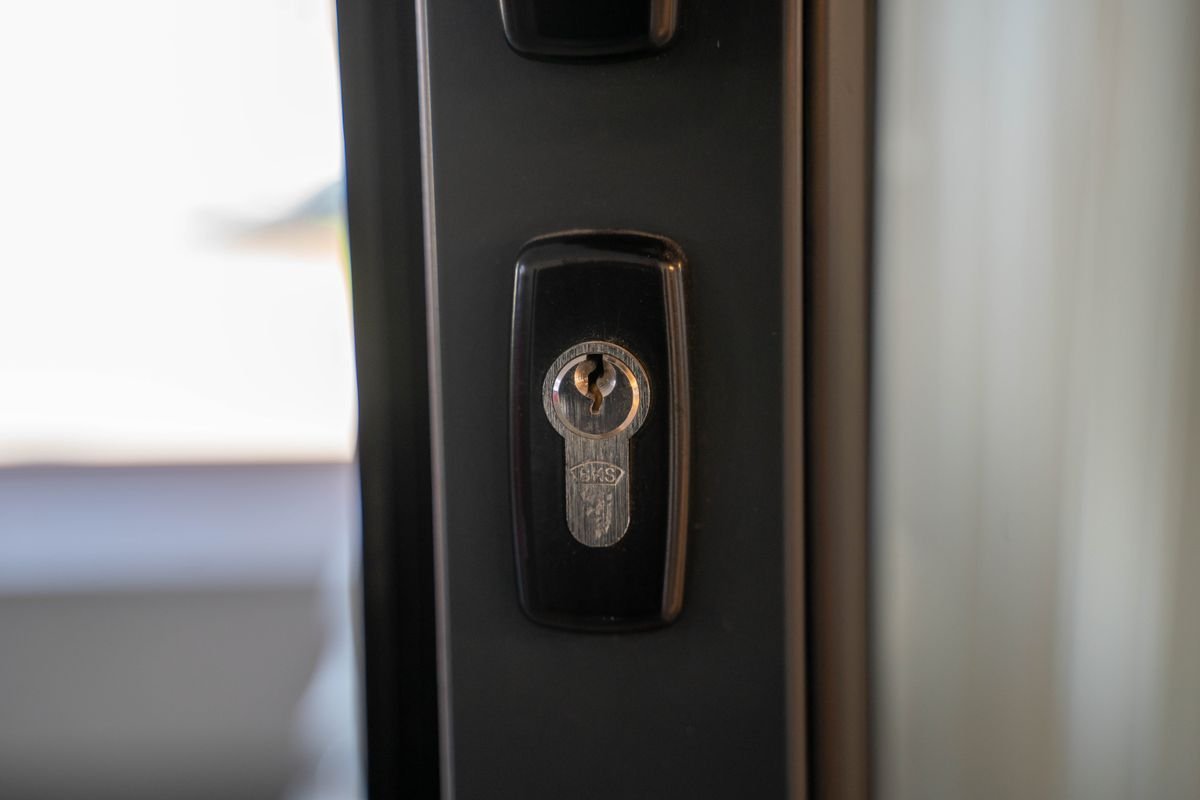 Locksmith in Croydon fitting a door lock