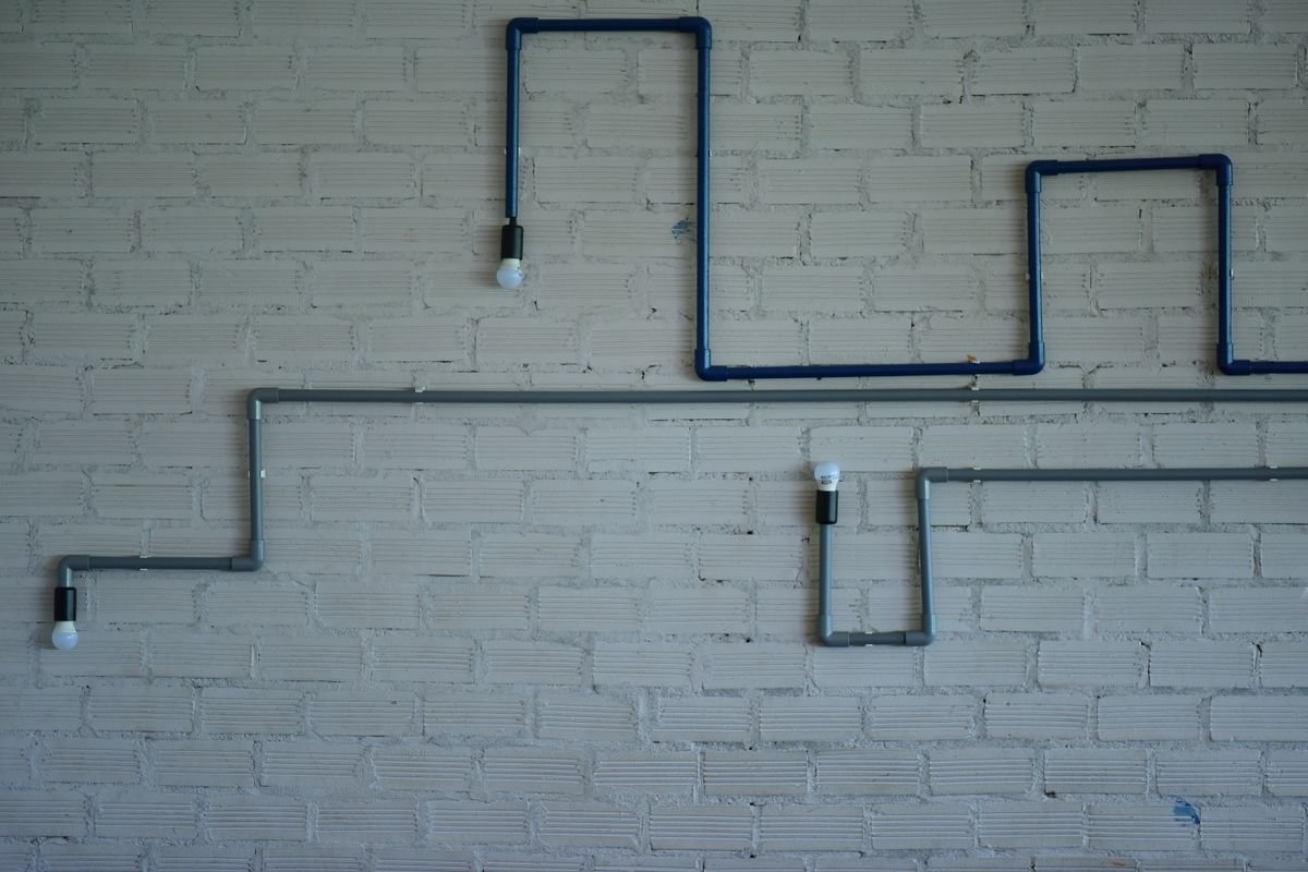 Plumber in Harrow repairing pipework